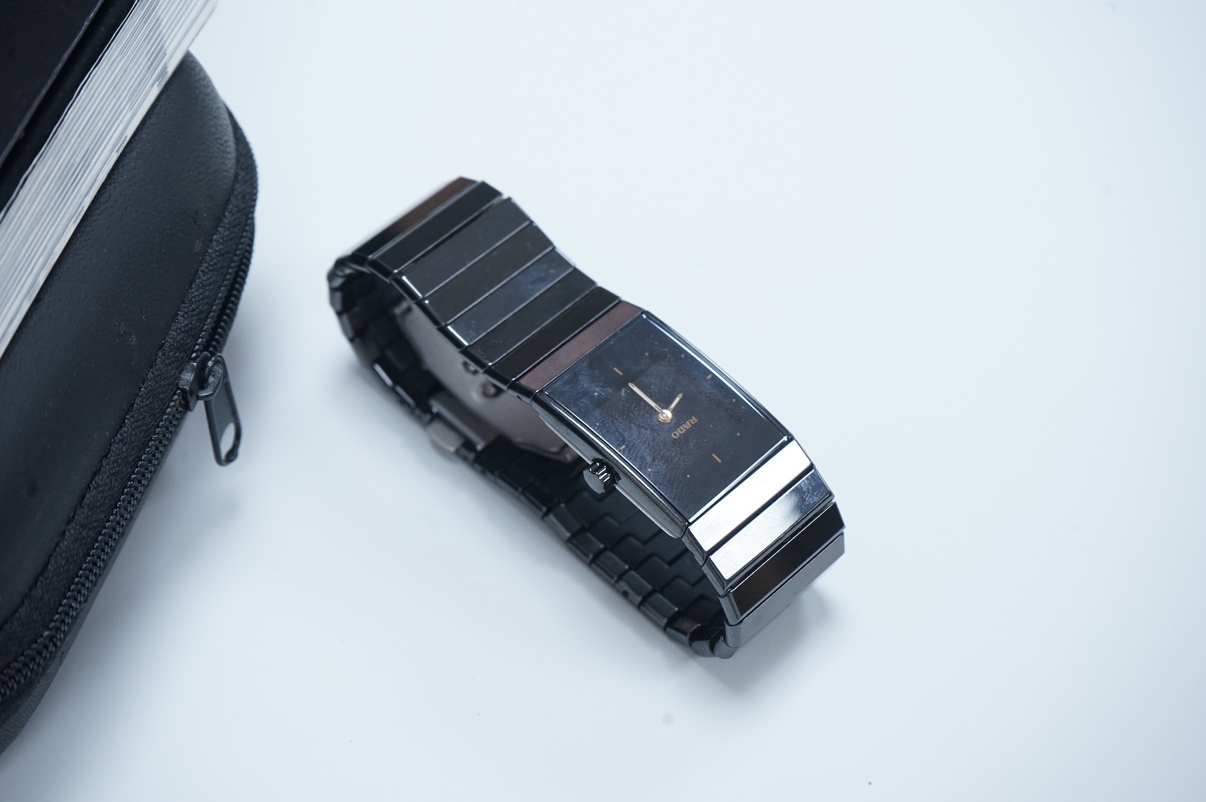 A modern Swiss titanium and ceramic Rado Diastar quartz wrist watch, with rectangular dial and dot markers, case diameter 25mm, with Rado box and booklet.